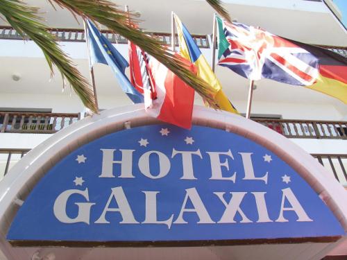 a sign for a hotel calva with flags at Galaxia Boutique Hotel in Can Picafort