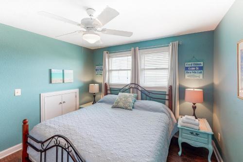 a bedroom with a bed and a ceiling fan at Reel Living #3-AV in Avon