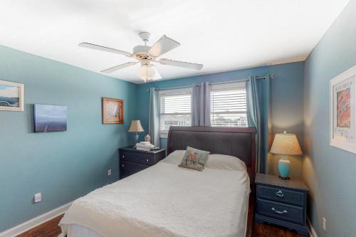 a bedroom with a bed and a ceiling fan at Reel Living #3-AV in Avon