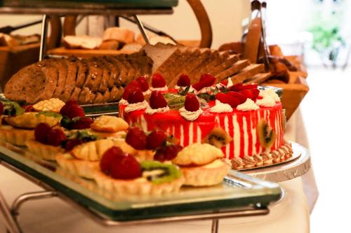 a buffet of sandwiches and pastries on a table at Riad Palais Des Princesses & Spa in Marrakesh