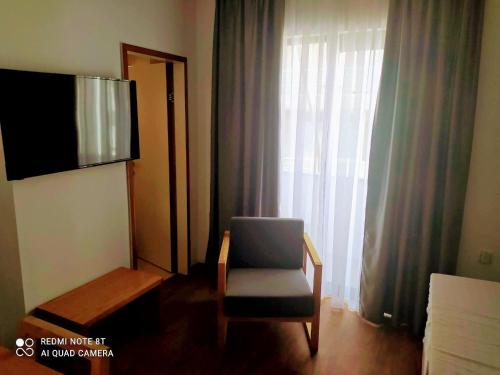 Телевизор и/или развлекательный центр в Saint George Boutique Rooms