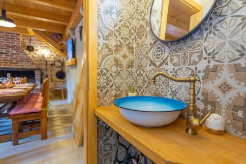 a bathroom with a large bowl sink on a counter at Vintage Kuzina in Poljica