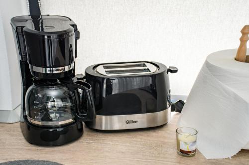 a coffee maker sitting on top of a counter at apart bun in Oradea