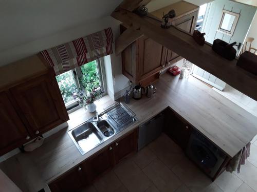 an overhead view of a kitchen with a sink at The Old Cowshed in Roundwood