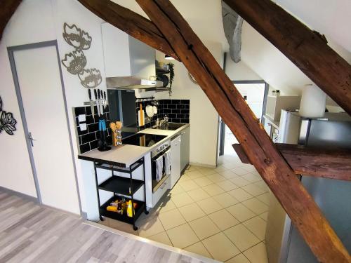 an overhead view of a kitchen with an attic at La Machine Sous Toit in La Machine