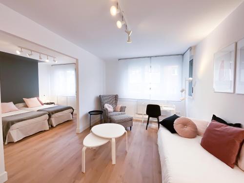 a living room with a couch and a table at Pensión Labra in Cangas de Onís