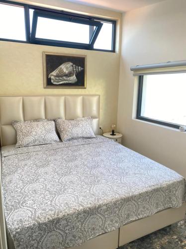 a bedroom with a bed and a window at Martin Lux Apartment in Krasici