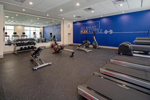 a gym with tread machines and a blue wall at Holiday Inn Express & Suites - Valencia - Santa Clarita by IHG in Valencia