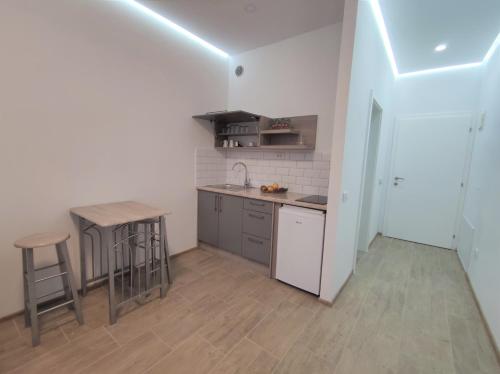 Kuchyň nebo kuchyňský kout v ubytování Evita Apartmani Šibovska