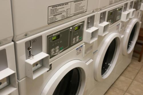 a row of washing machines in a laundrette at Gray Wolf Inn & Suites in West Yellowstone