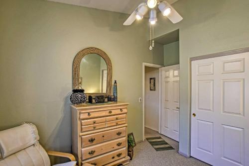a room with a dresser and a mirror and a door at Charming Anthem Home with Fire Pit, 1 Mi to Park! in Anthem