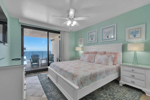 a bedroom with a bed and a view of the ocean at Windward Pointe Unit 901 in Orange Beach