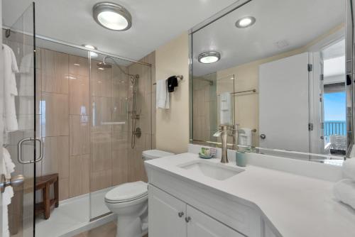 a bathroom with a toilet and a sink and a shower at Windward Pointe Unit 901 in Orange Beach