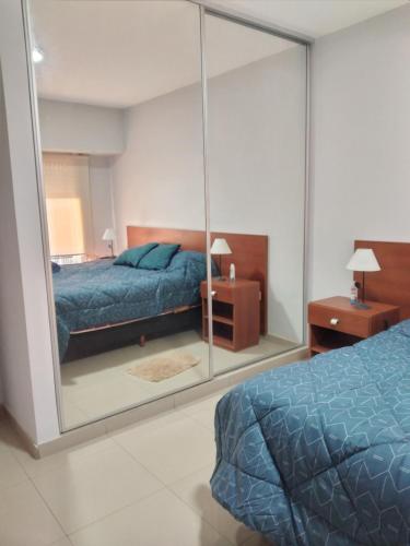
A bed or beds in a room at Depto. EZEIZA 15 minutos Aeropuerto (Traslados in/out)
