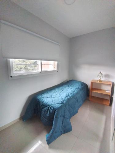 
A bed or beds in a room at Depto. EZEIZA 15 minutos Aeropuerto (Traslados in/out)
