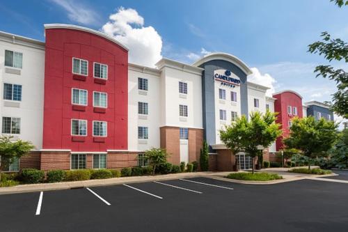 a parking lot in front of a hotel at Candlewood Suites Greenville by IHG in Greenville