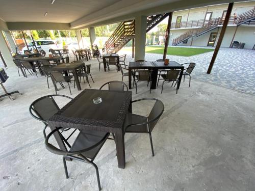 a group of tables and chairs on a patio at AURUM-hotel in Berdyansʼk