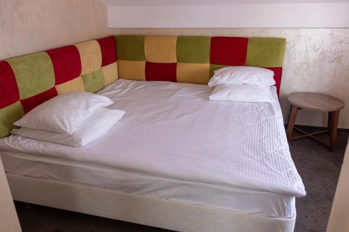 
Кровать или кровати в номере Hotel Aristokrat
