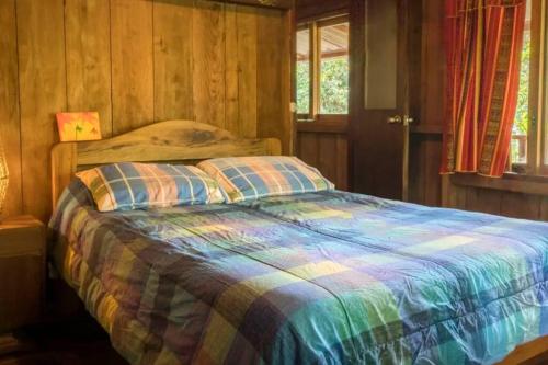 Voodi või voodid majutusasutuse Mindo cozy house toas