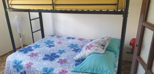 a bunk bed with two pillows on top of it at Soleil levant in Petit-Bourg