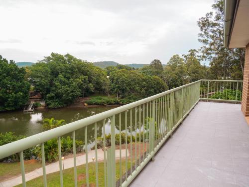 a balcony with a view of a river at Nightcap at Hinterland Hotel Nerang in Gold Coast