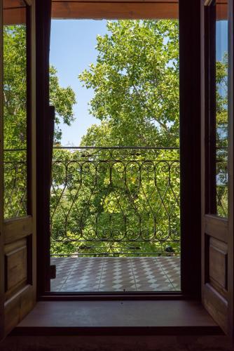 an open door to a balcony with a view at Helene Eco Luxury Villa in Tsagarada