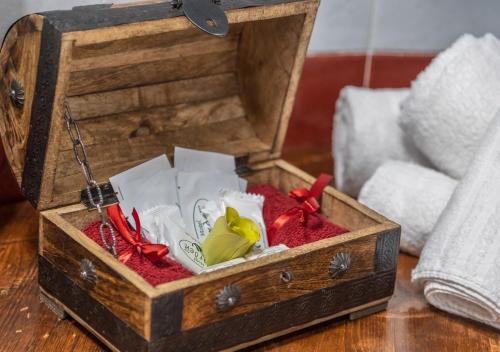 a wooden box with shoes in it on a table at Garden Wellness Hotel S in Andalo