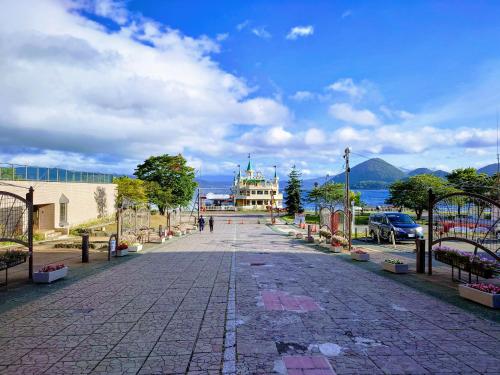 an empty street with a building in the background at Toya Kohan Tei in Lake Toya