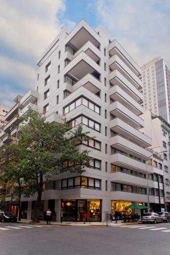 a large white building on a city street at Bulnes Eco Suites in Buenos Aires