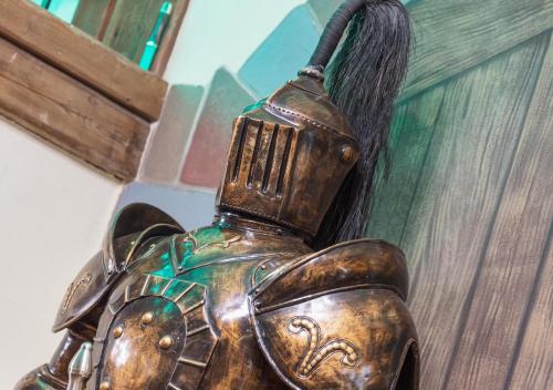 a bronze statue of an elephant with a brush at Garden Wellness Hotel S in Andalo