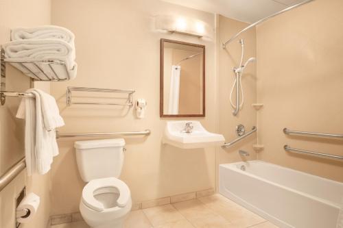a bathroom with a toilet and a sink at Candlewood Suites Yuma, an IHG Hotel in Yuma