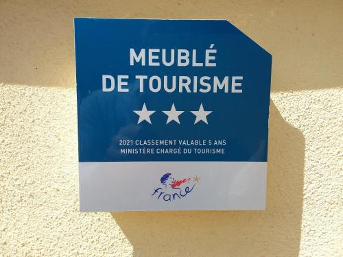 a sign on a wall that reads mobile dc tourism at Appartement lumineux, calme et panoramique !! in Pouligney