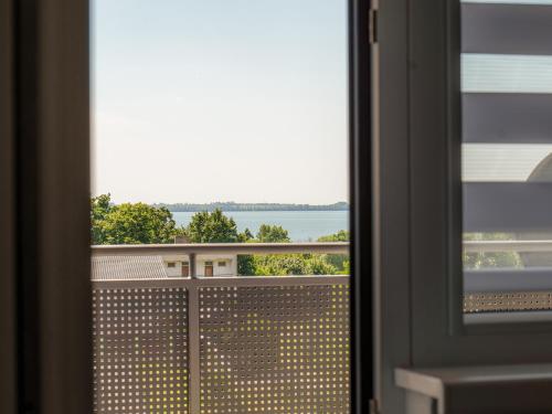 a view of the water from a window at Apartmany Motocentrum in Kaluža