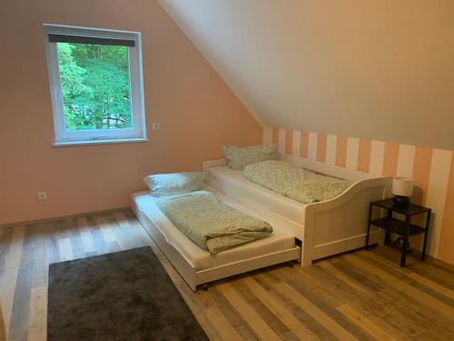 Postel nebo postele na pokoji v ubytování Ferienhaus Pfefferminzhütte