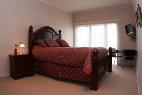 Ένα ή περισσότερα κρεβάτια σε δωμάτιο στο Richmond Farm Lodge