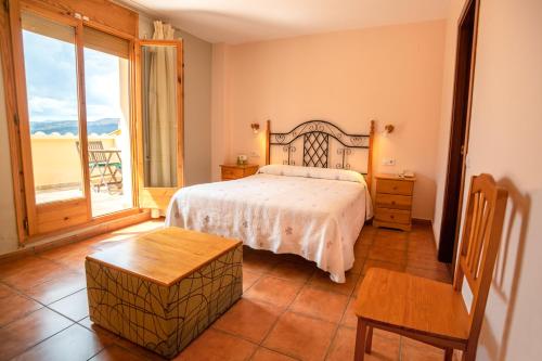 Postel nebo postele na pokoji v ubytování Hotel Castellote