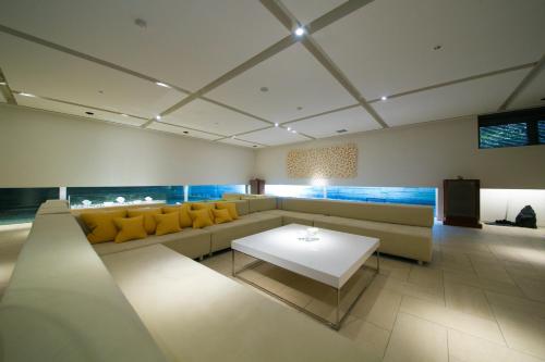 a living room with a couch and a table at Bourou NOGUCHI Noboribetsu (Adult Only) in Noboribetsu