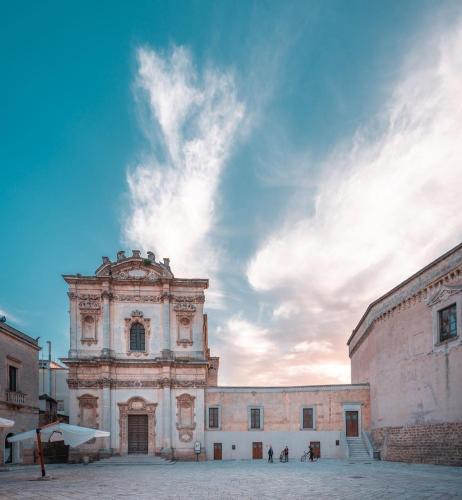 a large stone building with a sky in the background at Villa Vittoria in Mesagne
