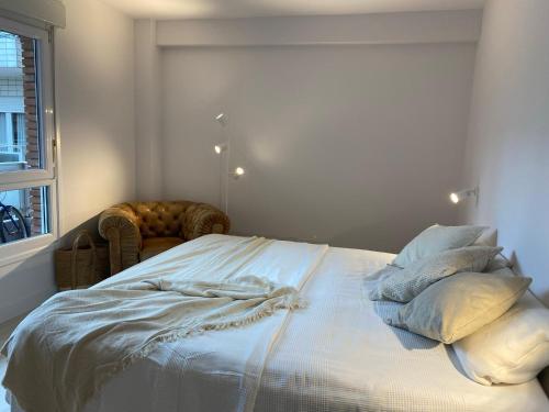 Ένα ή περισσότερα κρεβάτια σε δωμάτιο στο Apartamento M Garaje Playa Golf