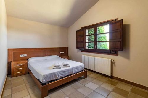 Posteľ alebo postele v izbe v ubytovaní Mas Aimà Casa rural en la Garrotxa