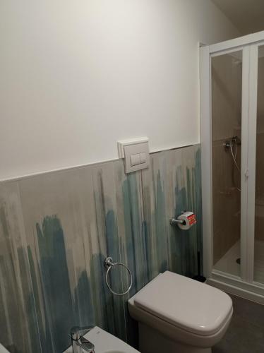 a bathroom with a toilet and a shower at Bouganville da Giò in Scalea