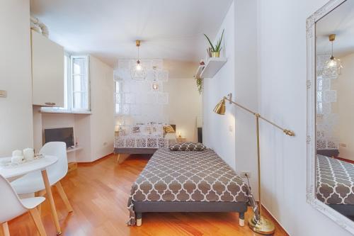 Ένα ή περισσότερα κρεβάτια σε δωμάτιο στο Il Rifugio del Principe-ampio monolocale in centro