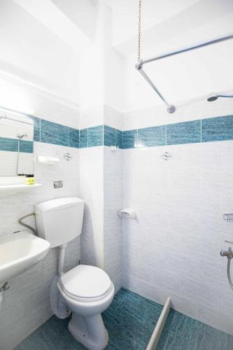 a bathroom with a toilet and a sink at Kafieris View in Firostefani