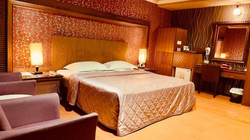 Säng eller sängar i ett rum på Dong Zhi Gang Motel