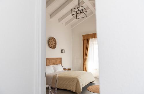Postel nebo postele na pokoji v ubytování Albergo Rurale Casa Fois