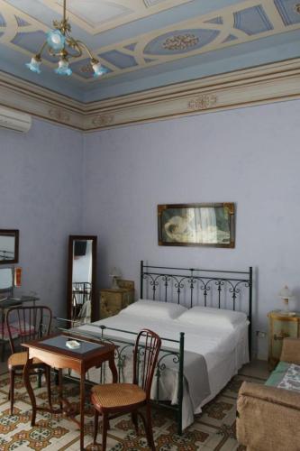 Ένα ή περισσότερα κρεβάτια σε δωμάτιο στο Villa Genny