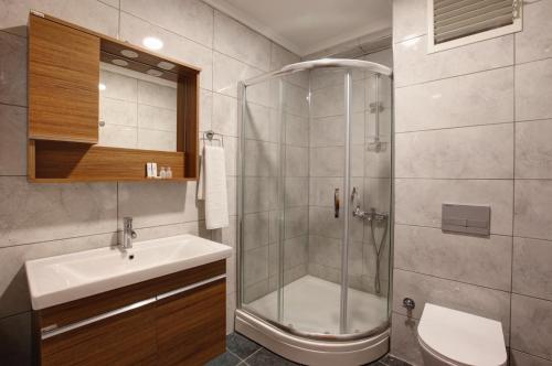 a bathroom with a shower and a sink at Family Time Suites Hotel in Istanbul