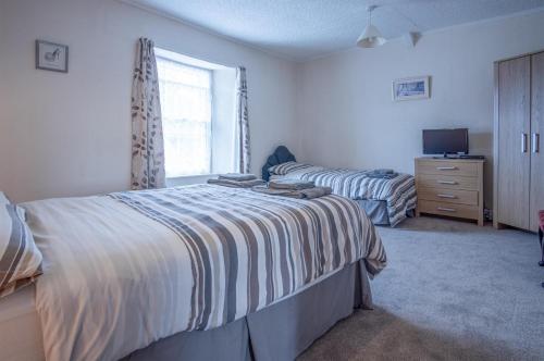 Foto da galeria de Dragons Den - 2 Bedroom Apartment - Tenby em Tenby