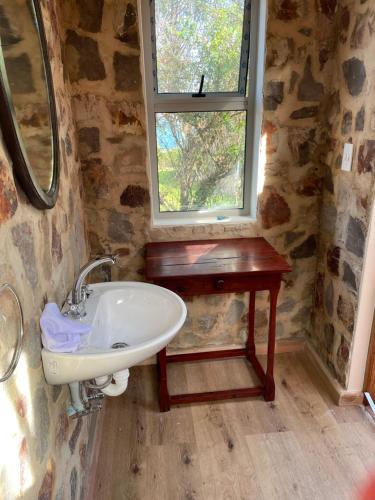 Ванная комната в Trinity Farm Ocean view Cottage
