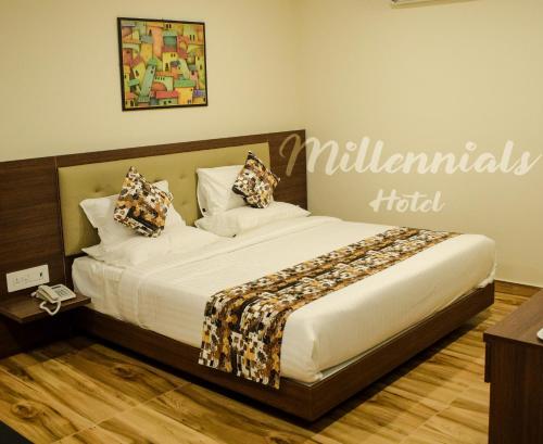 Een bed of bedden in een kamer bij Millennials Hotel